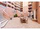 Elegant courtyard with lush plants, seating areas, and a water fountain feature at 2515 S Atlantic Ave # 509, Daytona Beach, FL 32118