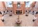 Top-down view of a courtyard with a fountain, tables, and chairs for relaxing at 2515 S Atlantic Ave # 509, Daytona Beach, FL 32118