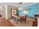 Modern dining area boasts a contemporary light fixture, sleek furnishings, and an accent wall at 2515 S Atlantic Ave # 509, Daytona Beach, FL 32118