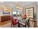 Open-concept dining area flows into the living room, featuring modern lighting and stylish furnishings at 2515 S Atlantic Ave # 509, Daytona Beach, FL 32118