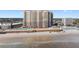 Beautiful beachside condo with a pool and boardwalk on the beach, framed by blue skies at 2515 S Atlantic Ave # 509, Daytona Beach, FL 32118