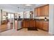 Modern kitchen with tile flooring, stainless steel appliances, and a seamless transition to the living area at 2515 S Atlantic Ave # 509, Daytona Beach, FL 32118
