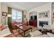 Elegant living room with fireplace and comfortable seating, featuring large windows for natural light and ocean views at 2515 S Atlantic Ave # 509, Daytona Beach, FL 32118