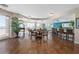 Bright lounge with tile floor, piano, tables, chairs, bar, and ocean view at 2515 S Atlantic Ave # 509, Daytona Beach, FL 32118