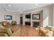 Lounge room with couches, chairs, fireplace, mirror, and television at 2515 S Atlantic Ave # 509, Daytona Beach, FL 32118