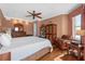 A comfortable main bedroom featuring an armchair, stylish decor, and plenty of natural light at 2515 S Atlantic Ave # 509, Daytona Beach, FL 32118