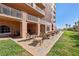 Community patio with tables, chairs, and ocean view, accessible to building residents at 2515 S Atlantic Ave # 509, Daytona Beach, FL 32118