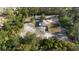 Expansive aerial view of a home surrounded by lush greenery offering privacy and tranquility at 2530 Leonard Dr, Deltona, FL 32725