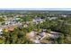 Wide aerial shot showing the home's location within a serene neighborhood near a picturesque lake at 2530 Leonard Dr, Deltona, FL 32725