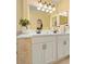 Bright bathroom featuring double sinks and quartz counters at 2530 Leonard Dr, Deltona, FL 32725