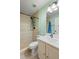 Bright bathroom featuring a walk-in shower with a pebble floor and a modern vanity with white countertop at 2530 Leonard Dr, Deltona, FL 32725
