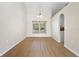 Dining area showcases wood floors, neutral walls, and large windows, perfect for entertaining guests at 2530 Leonard Dr, Deltona, FL 32725