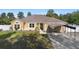 Charming single-story home featuring a two-car garage, carport, landscaped front yard, and inviting curb appeal at 2530 Leonard Dr, Deltona, FL 32725
