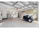 Spacious garage features a utility sink, washer/dryer hookups, and ample room for storage and projects at 2530 Leonard Dr, Deltona, FL 32725