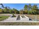 Backyard garden features two raised garden beds ready for planting, set against a backdrop of mature trees at 2530 Leonard Dr, Deltona, FL 32725