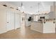 Spacious kitchen featuring white cabinets, stainless steel appliances, and breakfast bar seating at 2530 Leonard Dr, Deltona, FL 32725