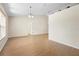 Bright, open-concept living room features wood floors, neutral paint, tall ceilings and natural light at 2530 Leonard Dr, Deltona, FL 32725