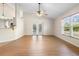 Bright living room features vaulted ceilings, a window and sliding doors to a patio at 2530 Leonard Dr, Deltona, FL 32725