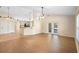 Living room featuring wood floors, an open layout, and access to the patio at 2530 Leonard Dr, Deltona, FL 32725
