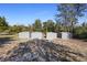 Four storage sheds in the backyard provide ample space for gardening tools and equipment at 2530 Leonard Dr, Deltona, FL 32725