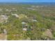 Expansive aerial view showcasing the property's size, natural surroundings, and equestrian facilities at 2646 Turnbull Bay Rd, New Smyrna Beach, FL 32168
