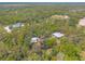 An aerial view highlighting property's landscaping, pond, nearby equestrian facilities at 2646 Turnbull Bay Rd, New Smyrna Beach, FL 32168