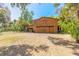 Spacious barn with ample storage and covered parking, nestled amongst lush greenery and mature trees at 2646 Turnbull Bay Rd, New Smyrna Beach, FL 32168