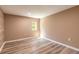 Cozy bedroom with wood-look floors and natural light at 2646 Turnbull Bay Rd, New Smyrna Beach, FL 32168