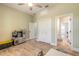 Bright bedroom with ceiling fan, wood flooring, and play kitchen set, perfect for a room at 2646 Turnbull Bay Rd, New Smyrna Beach, FL 32168