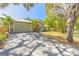 Lovely single-story home featuring a spacious garage and beautiful, paver driveway at 2646 Turnbull Bay Rd, New Smyrna Beach, FL 32168