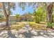 Charming single-story home with lush landscaping, walkway and a welcoming arched entryway at 2646 Turnbull Bay Rd, New Smyrna Beach, FL 32168