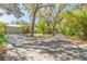 Inviting single-story home boasting an extra long driveway and lush, mature trees at 2646 Turnbull Bay Rd, New Smyrna Beach, FL 32168