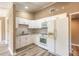 This kitchen features white cabinets, granite countertops, and modern appliances at 2646 Turnbull Bay Rd, New Smyrna Beach, FL 32168