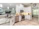 Well-lit kitchen with modern appliances, ample counter space, and wood-look flooring at 2646 Turnbull Bay Rd, New Smyrna Beach, FL 32168