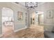 Open-concept living area showcasing archways, built-in shelving, and access to the kitchen at 2646 Turnbull Bay Rd, New Smyrna Beach, FL 32168