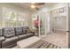 Comfortable living room with shuttered windows, a ceiling fan, and French doors to another room at 2646 Turnbull Bay Rd, New Smyrna Beach, FL 32168