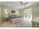 Inviting main bedroom with a ceiling fan and access to a balcony, offering a relaxing and private retreat at 2646 Turnbull Bay Rd, New Smyrna Beach, FL 32168