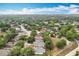 An aerial shot of a suburban neighborhood with tree-lined streets highlighting the community's layout and charm at 30029 Pga Dr, Sorrento, FL 32776