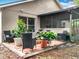 A backyard patio featuring a seating area, perfect for enjoying outdoor moments with plants at 30029 Pga Dr, Sorrento, FL 32776