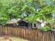 Fenced backyard with a screened-in porch and lush landscaping for outdoor enjoyment and privacy at 30029 Pga Dr, Sorrento, FL 32776