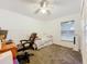 Bedroom with neutral carpet, white furniture, and window with natural light at 30029 Pga Dr, Sorrento, FL 32776