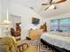 This spacious bedroom features a ceiling fan, TV, and neutral walls for a relaxing atmosphere at 30029 Pga Dr, Sorrento, FL 32776