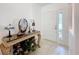 Home foyer featuring tiled floors and a decorative table at 30029 Pga Dr, Sorrento, FL 32776