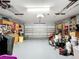 The organized garage includes storage, tools, and parking space at 30029 Pga Dr, Sorrento, FL 32776