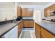 Well-equipped kitchen featuring tile flooring, ample counter space and cabinets at 30029 Pga Dr, Sorrento, FL 32776