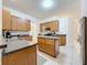 Bright kitchen with island, modern appliances and plenty of cabinet space at 30029 Pga Dr, Sorrento, FL 32776