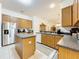Spacious kitchen with an island, stainless steel appliances, and ample counter space at 30029 Pga Dr, Sorrento, FL 32776