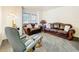Living room with comfortable seating and neutral walls at 30029 Pga Dr, Sorrento, FL 32776