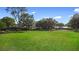 Large, well-maintained backyard with a spacious grassy area, perfect for recreation and outdoor enjoyment at 3005 Garden Rd, Eustis, FL 32726