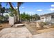 Landscaped backyard featuring a gazebo, storage shed, brick patio, and garden beds at 3005 Garden Rd, Eustis, FL 32726